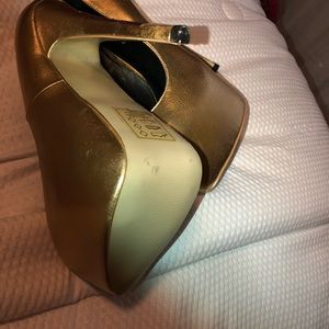 Gold platform heels.